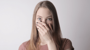 girl hiding face, cold sore