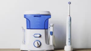 Irrigator and electric toothbrush